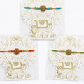 Kamdhenu Rakhi with Gold Mandala Charm