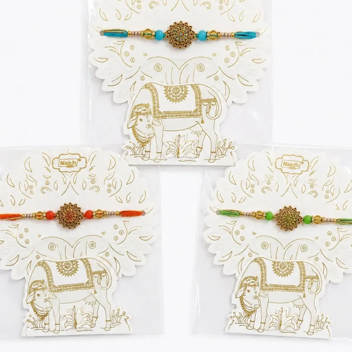 Kamdhenu Rakhi with Gold Mandala Charm